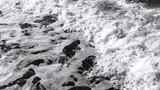 Fototapeta Przestrzenne - Foamy surf. Morning waves in the Mediterranean. In dark colors.