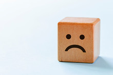 Small Wooden Dice With Sad Emotion