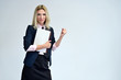 © Вячеслав Чичаев - Studio portrait of a pretty blonde student girl with long hair in a jacket on a white background. Smiling at camera with emotions in various poses.