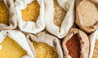 © oksix - Textile bags full of cereals, close up. Healthy eating concept