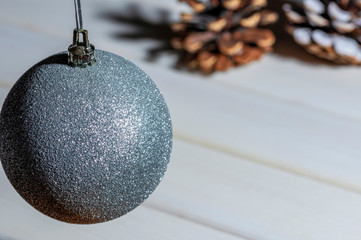 christmas ball on bright background,  copy space image