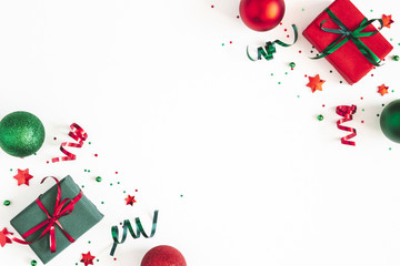 Christmas composition. Gifts, red and green decorations on white background. Christmas, winter, new year concept. Flat lay, top view, copy space