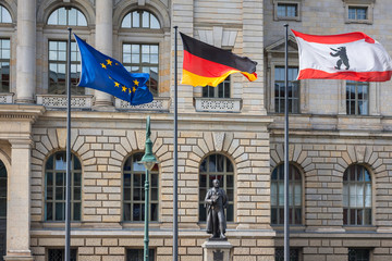 3 flags (Europe, Germany, Berlin) infront of Abgeordnetenhaus of Berlin, the state parliament for the German state of Berlin, Germany