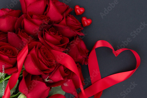 Red blooming roses on wood