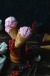 Berry ice cream dark wooden rustic background with blueberry, red currant