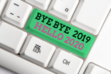 Handwriting Text Writing Bye Bye 2019 Hello 2020. Conceptual Photo Starting New Year Motivational Message 2019 Is Over White Pc Keyboard With Empty Note Paper Above White Background Key Copy Space
