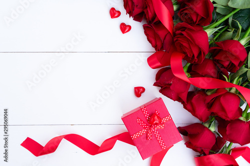 Red blooming roses on wood