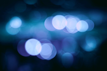 Lights blurred bokeh background from christmas night .