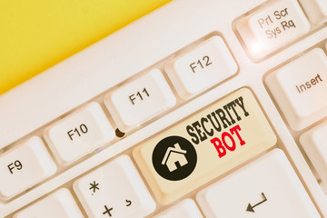 Text sign showing Security Bot. Business photo text software that performs an automated task over the Internet White pc keyboard with empty note paper above white background key copy space