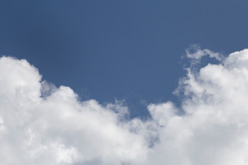 Wall Mural - white fluffy clouds in the blue sky
