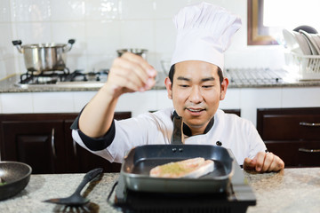 Asian Chef cooking in kitchen restaurant