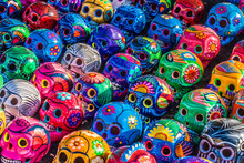 Mexican Culture Fiesta: Colorful (colourful) Traditional Mexican/hispanic Painted Ceramic Pottery Day Of The Dead (Dia De Los Muertos) Skulls On Display At A Market In Mexico. 