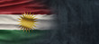 Kurdistan National Holiday. Kurdish Flag background with yellow sun and national colors.