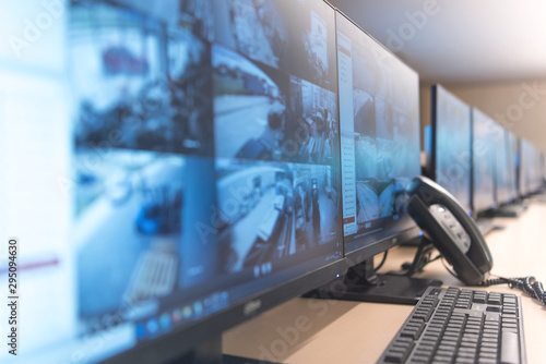Cuadros en Lienzo Security guard monitoring modern CCTV cameras in surveillance room