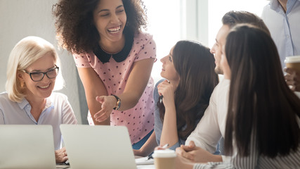 Wall Mural - International company diverse members working together laughing having fun