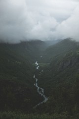 Sticker - Green mountains and a river under the white clouds