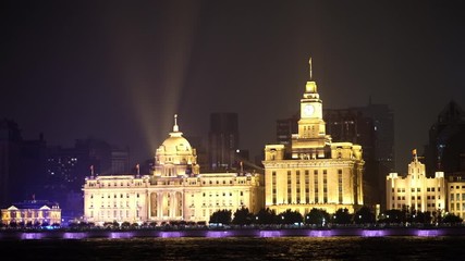 Wall Mural - beautiful night scene of the bund in Puxi Shanghai on the bank of the Huang Pu River. Close up shining golden exotic buildings under dark night skyline. Establishing shot