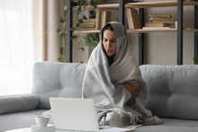 Sick Woman Feel Cold At Home Covered With Blanket