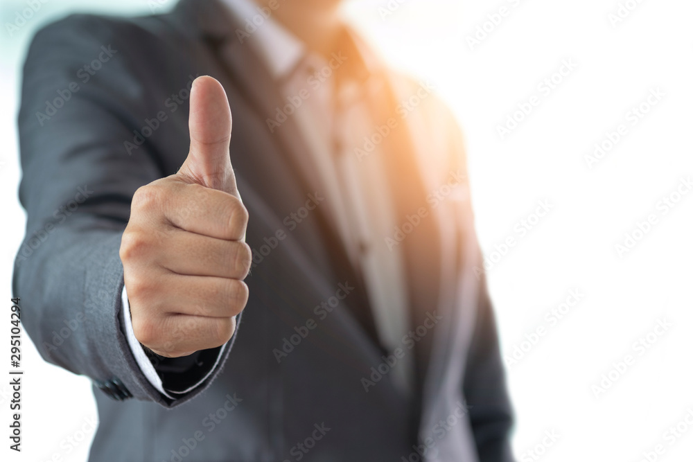 Businessman showing OK approve or like signal with thumb  raise up. Successful concept. - obrazy, fototapety, plakaty 