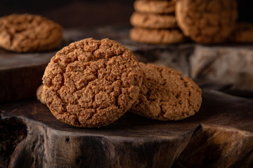 Biscuit with berry or fruit filling. Crispy and crumbly delicious cookies with natural ingredients: flour, nuts, seeds, pieces of chocolate, cocoa, fruit jams.   Stylish still life for poster.