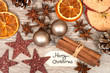christmas decoration and spices on wooden background