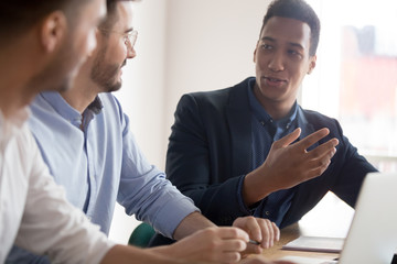 Canvas Print - African american businessman offering idea at diverse team meeting