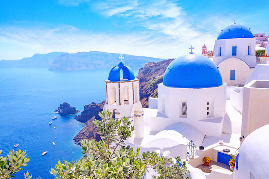 beautiful oia town on santorini island, greece. traditional white architecture and greek orthodox ch