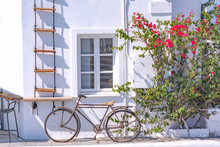 Vintage Bicycle In Picturesque Streets Of Oia Village On Santorini Island With Traditional White Architecture, Greece.
