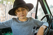 © Marc Romanelli - 6 year old boy  in 1970's era pick up truck