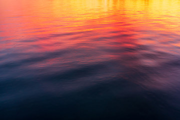 Sticker - Reflections of a beautiful orange sunset on water