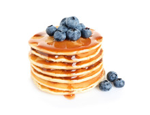 Stack Of Delicious Pancakes With Fresh Blueberries And Syrup On White Background