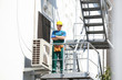 © New Africa - Young male technician near modern air conditioner outdoors