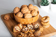 © ozgur - Whole walnuts in bowl. Dried figs with walnuts on wooden background.