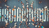 Fototapeta  - Aerial. People crowd on pedestrian crosswalk. Top view background. Toned image.