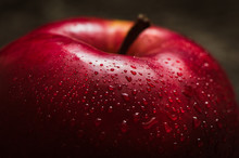 Apple Red. Close-up Of An Apple. Water Spray Droplets.