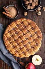 Homemade dessert, old fashioned lattice crust pie with grated apple and walnut filling, sprinkled with granulated sugar and cinnamon