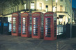 Red telephone boxes in London.