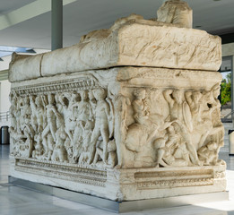 Ancient stone sarcophagus with battle scenes at the entrance of the Archaeological Museum of Thessaloniki Soldiers in battle Scene from foot of sarcophagus ancient macedonia greece