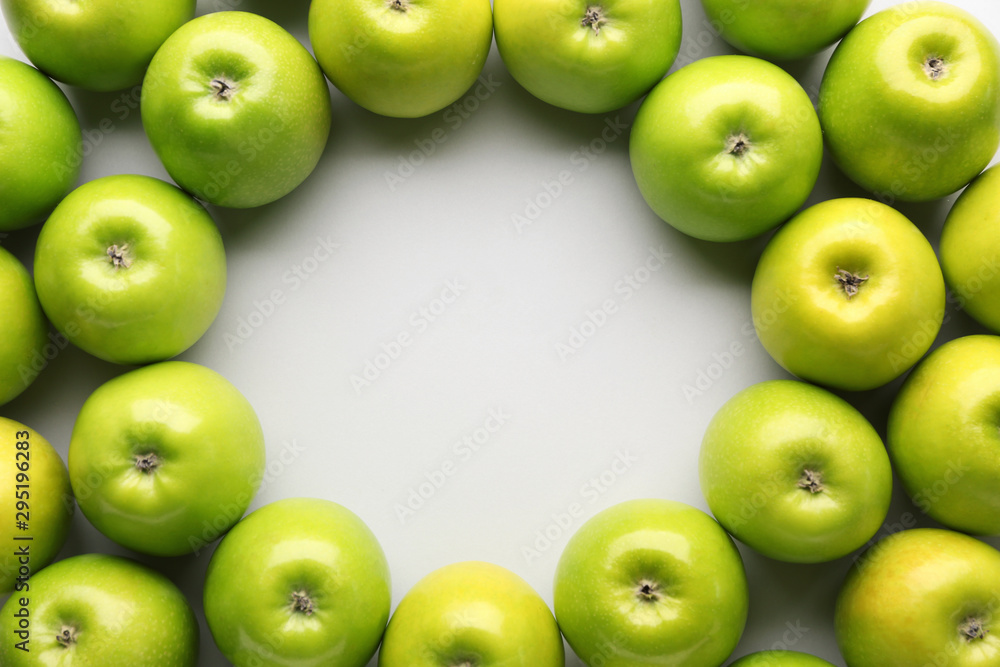 Frame made of fresh ripe apples on light background