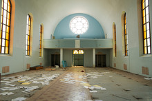 The Interior Of An Old And Abandoned Church, Light Shining Through The Windows.
