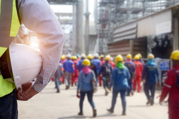 Safety officer holding hard hat