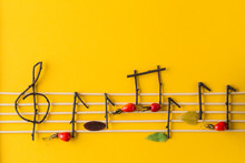 Musical Notes Conception. Wooden Musical Notes, Berries And Leaves.