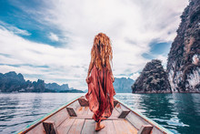 Fashionable Young Model In Boho Style Dress On Boat At The Lake