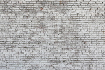 Old wall made of red brick, painted white in loft style for modern designer interior of room, bar or restaurant