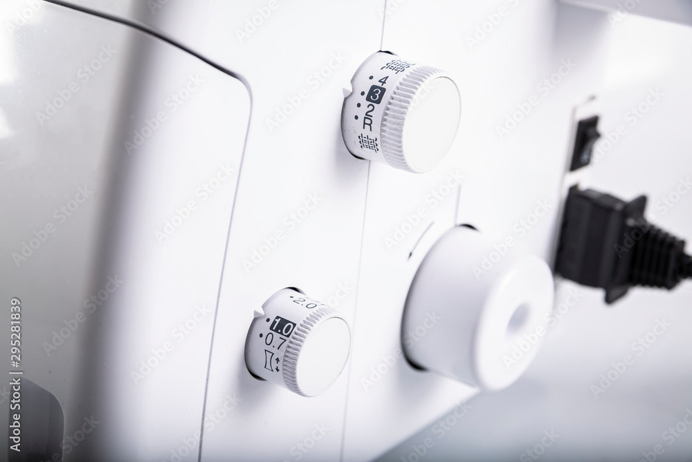 Overlock. Sewing machine. Professional modern sewing machine.