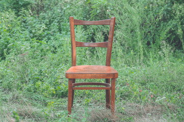 Pair old wooden chair outdoors. Two wooden folding chairs for rest. 