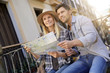 © goodluz - Couple of tourists in the street of european city