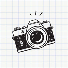 Photo Camera Doodle Icon. Hand Drawn Sketch In Vector