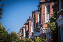 Row Of Typical British Red Brick Terraced Houses