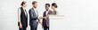 © LIGHTFIELD STUDIOS - panoramic shot of four multiethnic colleagues in formal wear talking and shaking hands